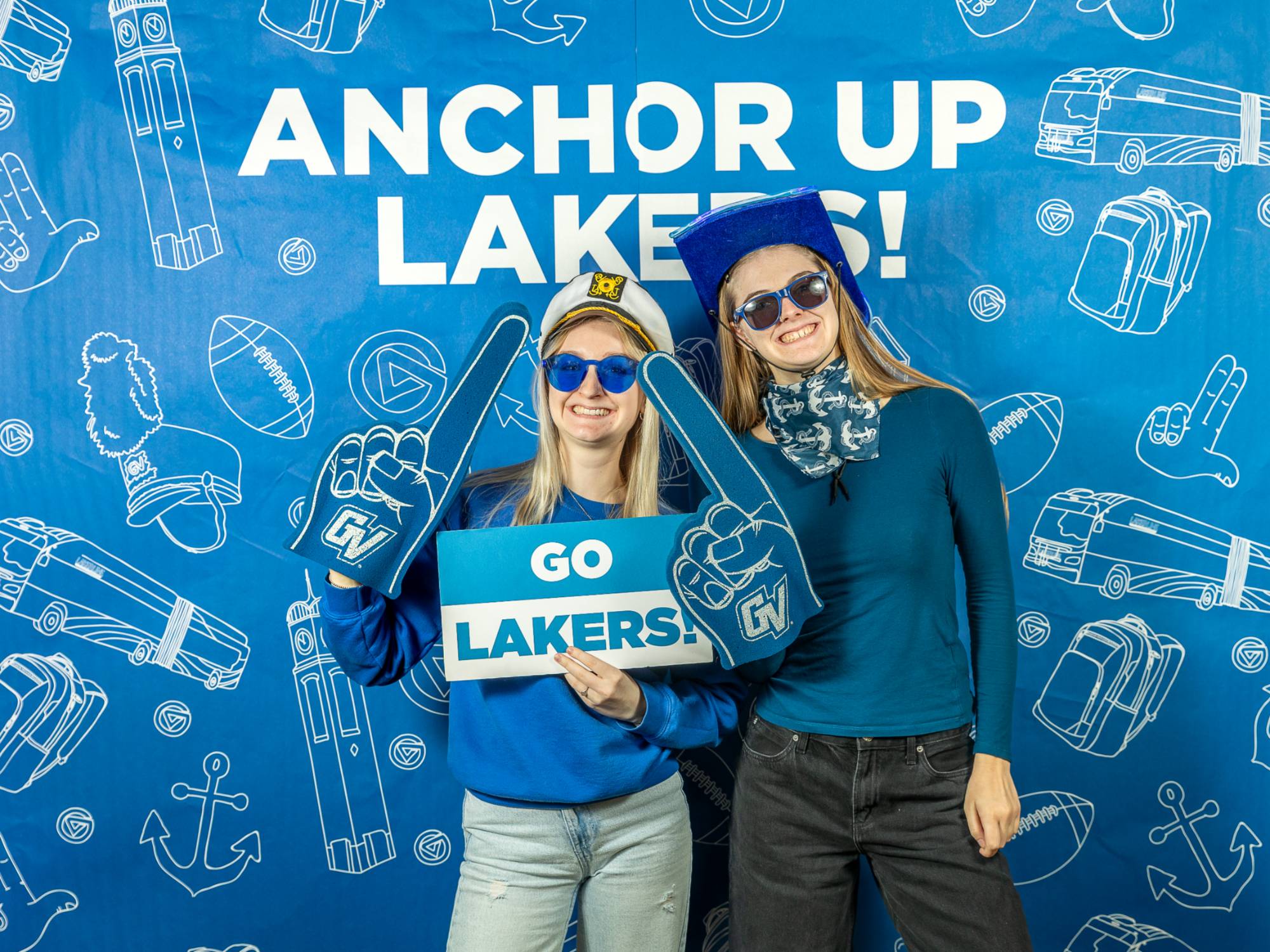 two students pose at GVSU photo booth